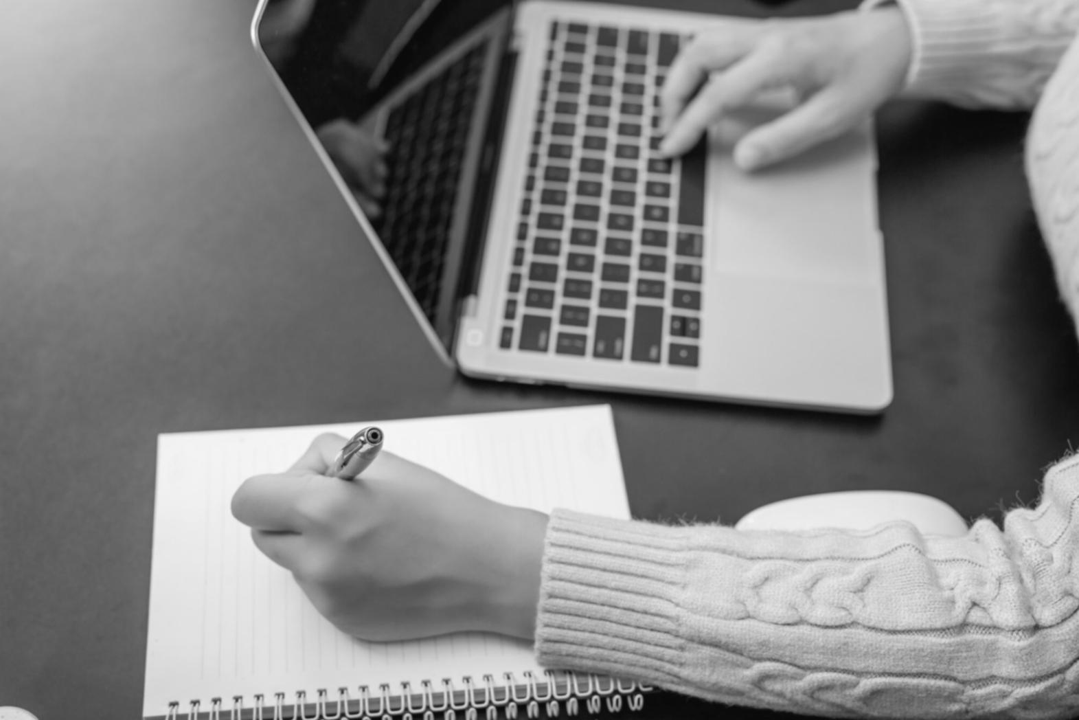 Professional budgeting consultation workspace with digital tools and financial planning materials
